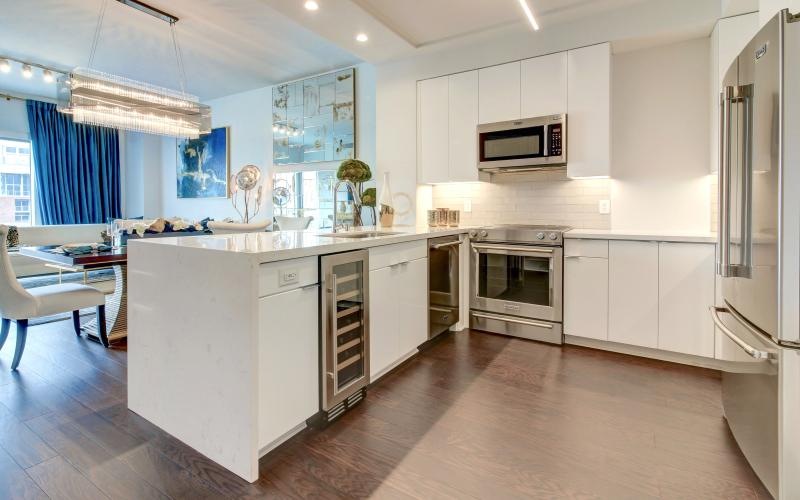 a kitchen with white cabinets