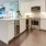 a kitchen with white cabinets