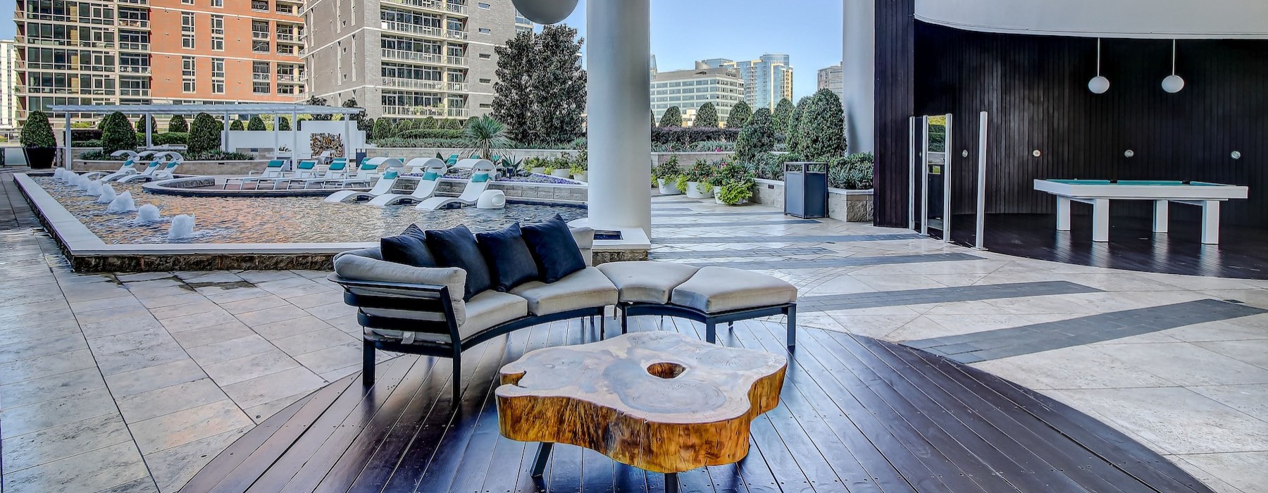 a courtyard with a table and chairs